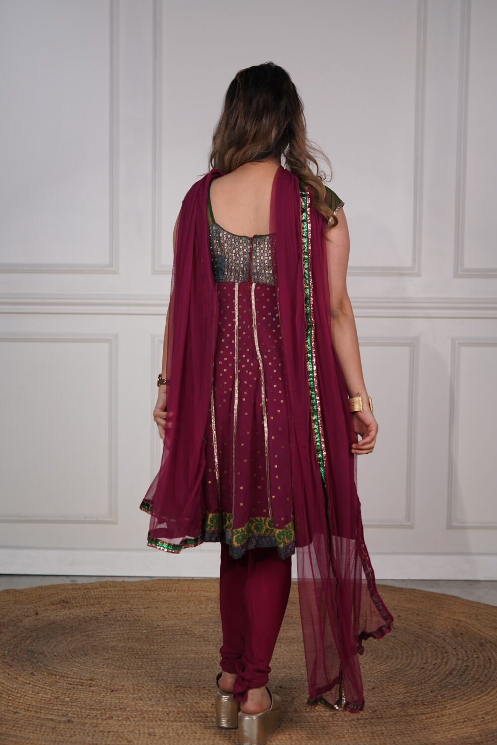 Wine Shade Short Anarkali Pajami Suit With Golden Handwork And Net Dupatta - Image 2